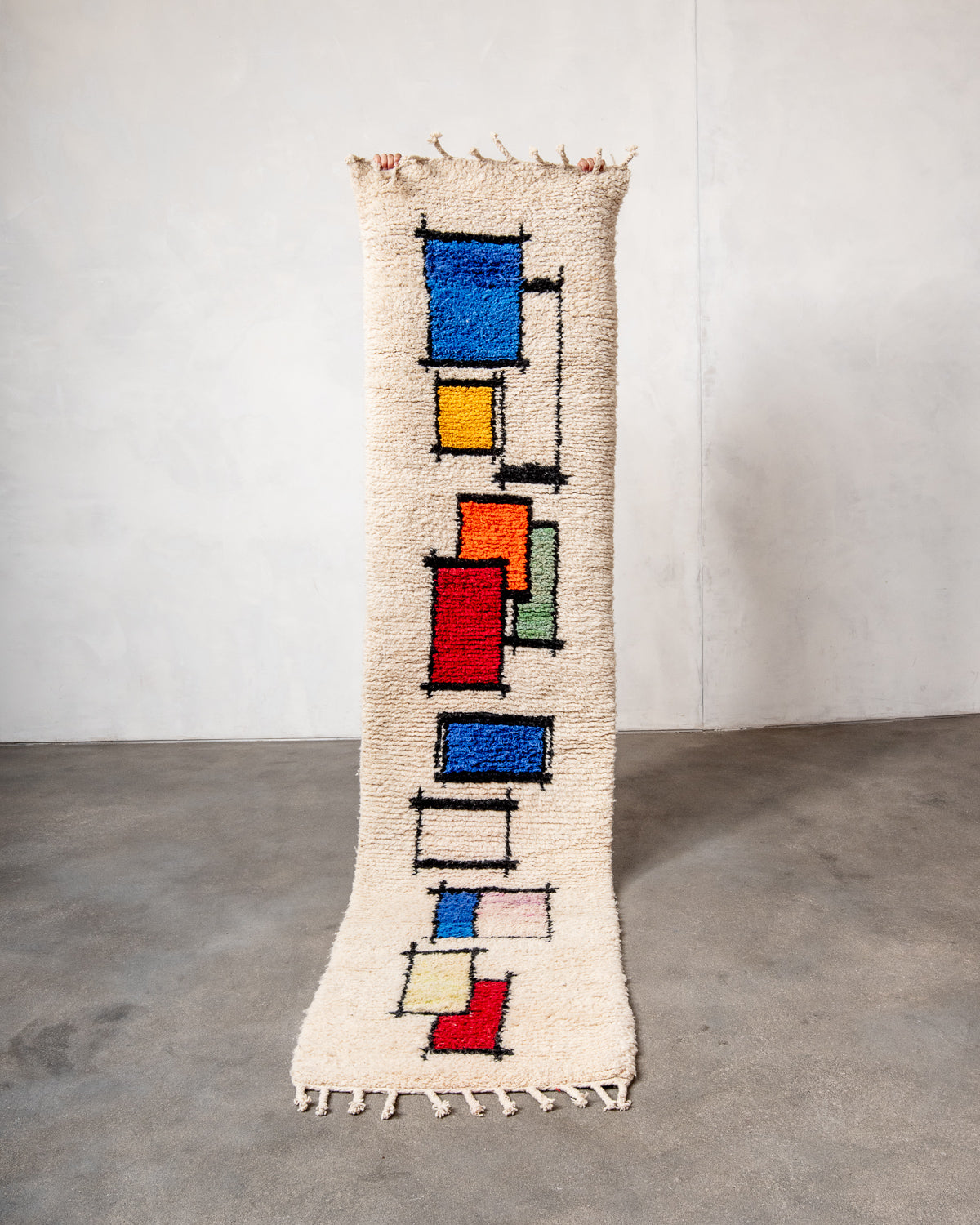 Modern, designer, handcrafted Berber runner rug from Morocco. Beniourain carpet with beautiful colours and patterns and fluffy wool texture.